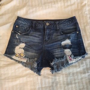 Harper- Medium wash Destructed Shorts W/ Floral Pocket Detailing- Size 27
